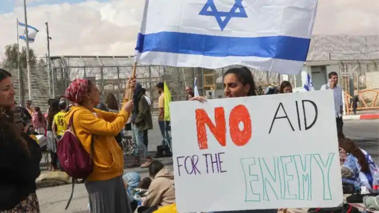 ‘Our aim is to get the hostages back’: Israeli protesters block aid convoys bound for Gaza