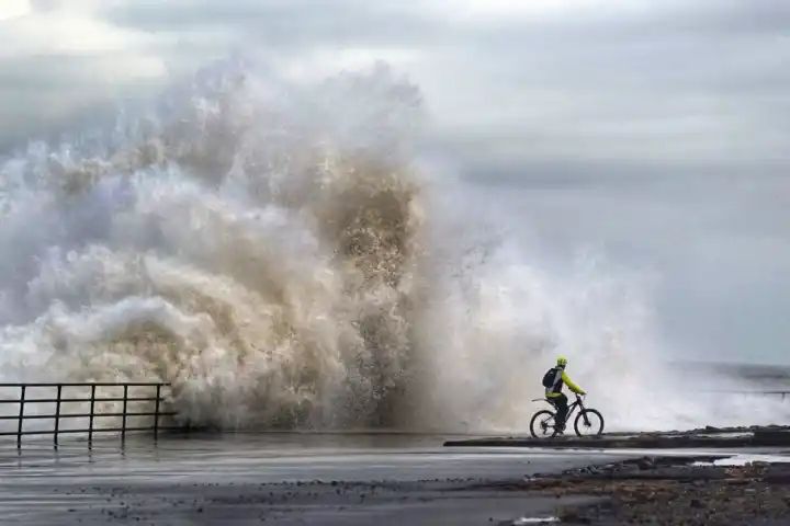 Flooding feared as heavy rain and strong gusts hit parts of UK