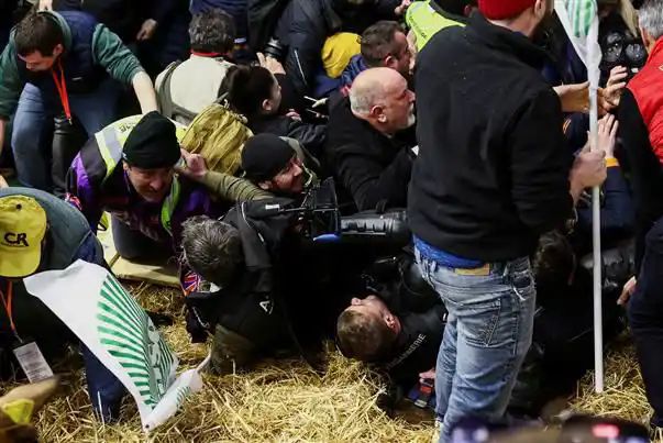 Angry French farmers storm into agriculture fair in Paris