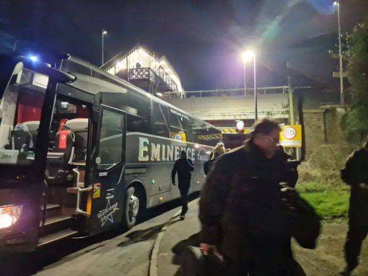 Coach passengers covered in debris as bus strikes low bridge