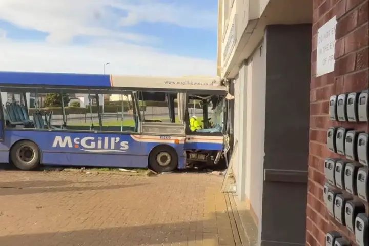 Five people hospitalised after bus crashes into block of flats in Paisley