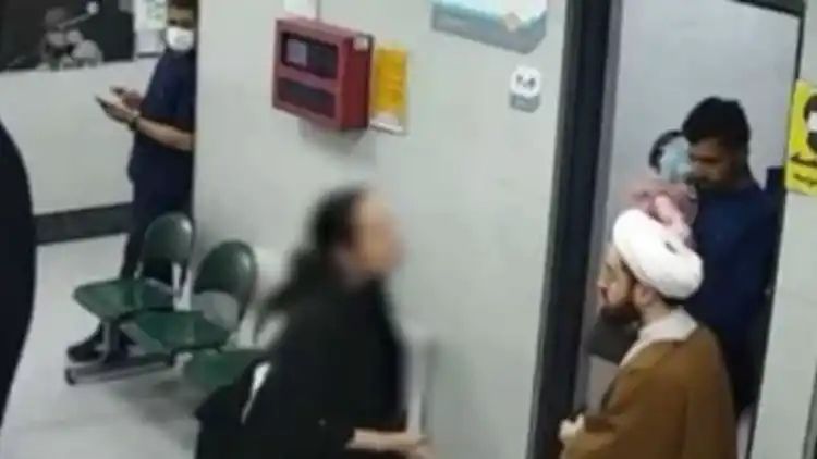 Iranian woman without hijab gets into a scuffle with cleric for clicking her picture