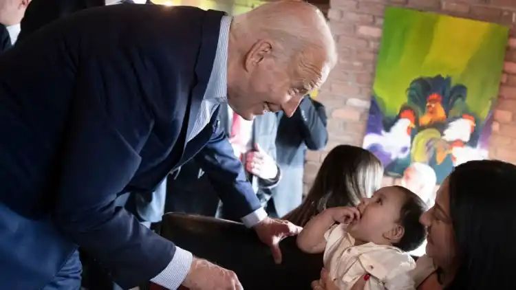 ‘Couldn’t resist’: Biden’s moment with baby interrupts campaign event