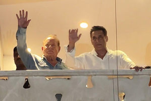 Salman, joined by father Salim Khan, greets cheering crowds outside Galaxy Apts