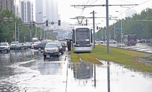 Flood-disrupted railway resumes traffic in China