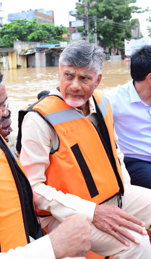 Chandrababu Naidu visits flood-affected Vijayawada in a boat