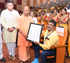 An unconventional tribute: Yogi Adityanath descends from dais to honour injured teacher