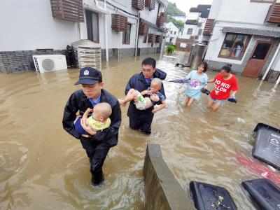 China raises emergency response to floods in Hainan as typhoon rages