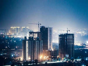 Listed Indian real estate players trim debt by 54 pc, bookings at record high